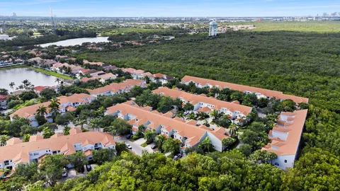 an aerial view of lake and city