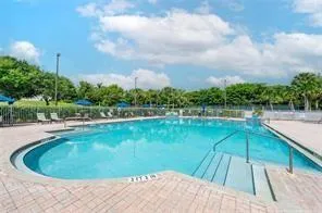 a view of a swimming pool from a balcony