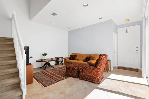 a living room with furniture and a rug