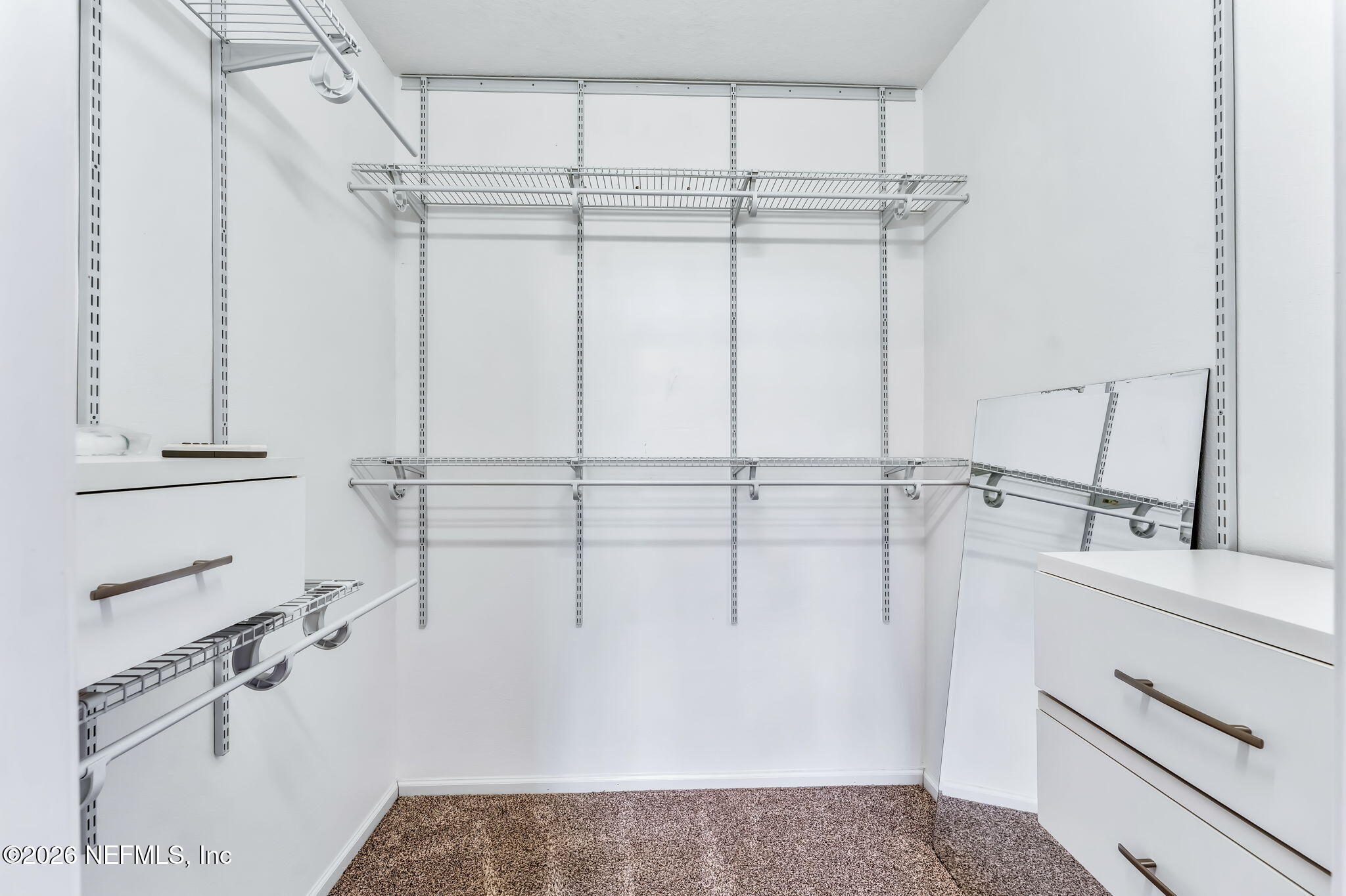 7990 Baymeadows Road East, Unit 520 Jacksonville, FL 32256 - Photo 26 of 41 a view of a room with racks on the wall