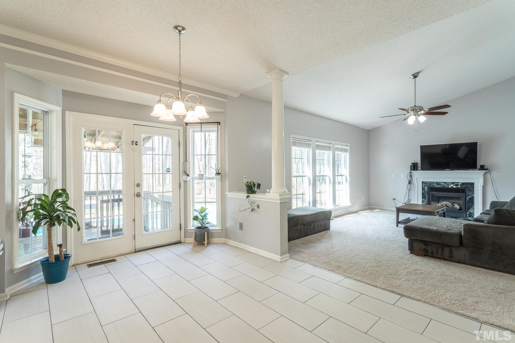 4900 Goosedown Court Raleigh, NC 27604 - Photo 17 of 41 The eat-in kitchen is open to a large family room with a fireplace. Natural light abounds!