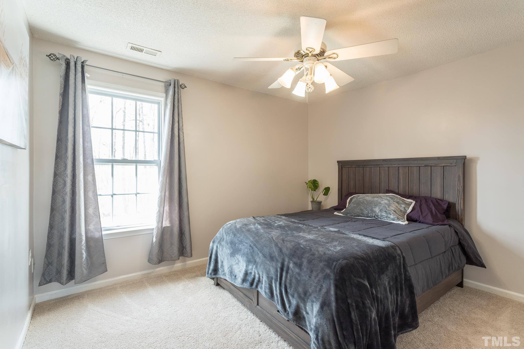 4900 Goosedown Court Raleigh, NC 27604 - Photo 32 of 41 One of three generously sized guest bedrooms located on the second floor.
