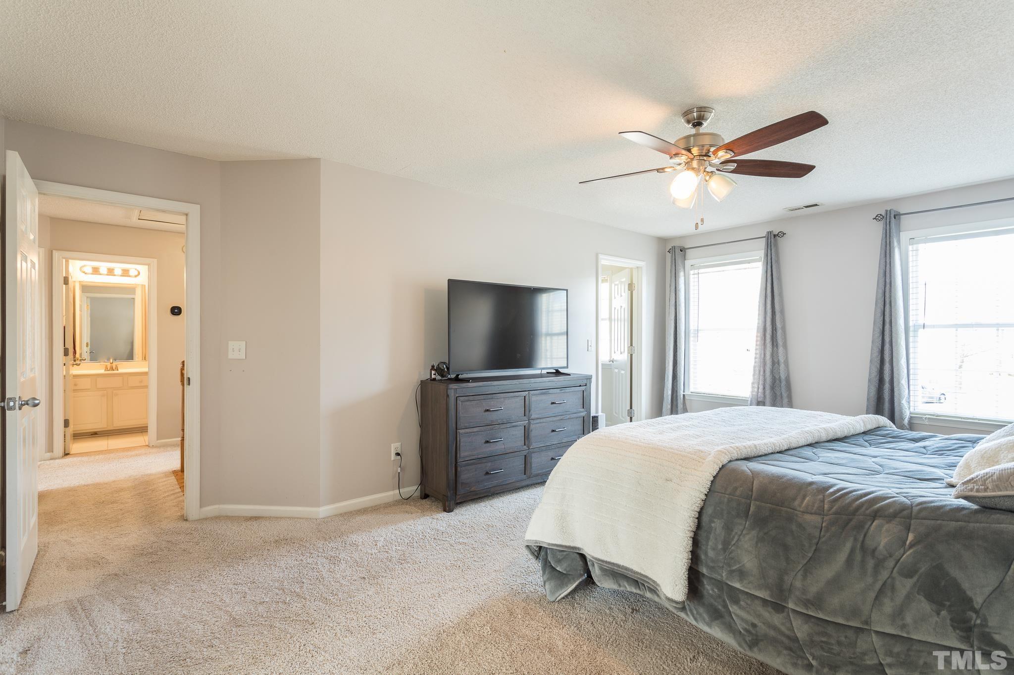 4900 Goosedown Court Raleigh, NC 27604 - Photo 36 of 41 The large master bedroom has plenty of natural light and walk--in closet.