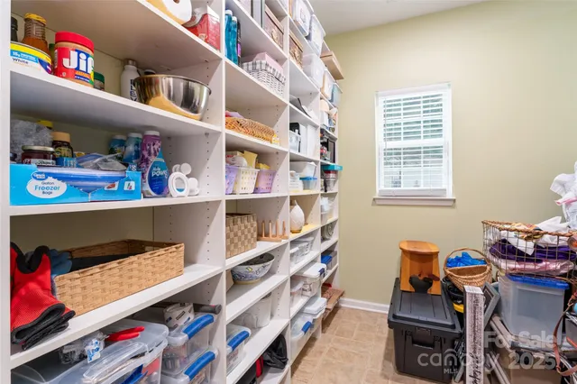 a room with furniture and a book shelf