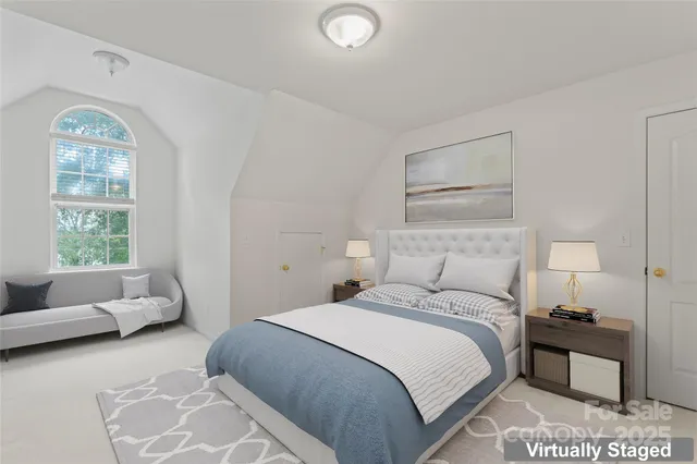 a bedroom with a bed and a couch