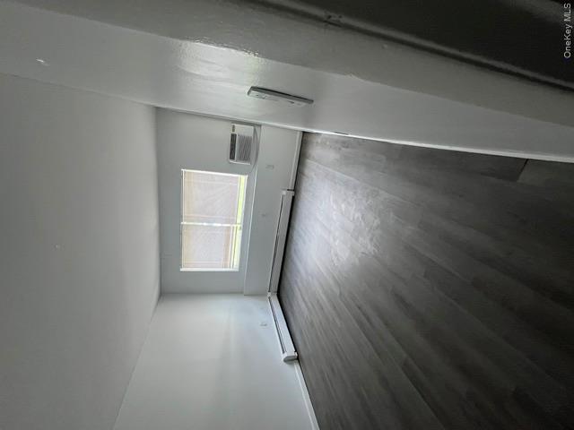 30 Tanager Road, Unit 3001 Monroe, NY 10950 - Photo 8 of 20 an empty room with wooden floor and windows