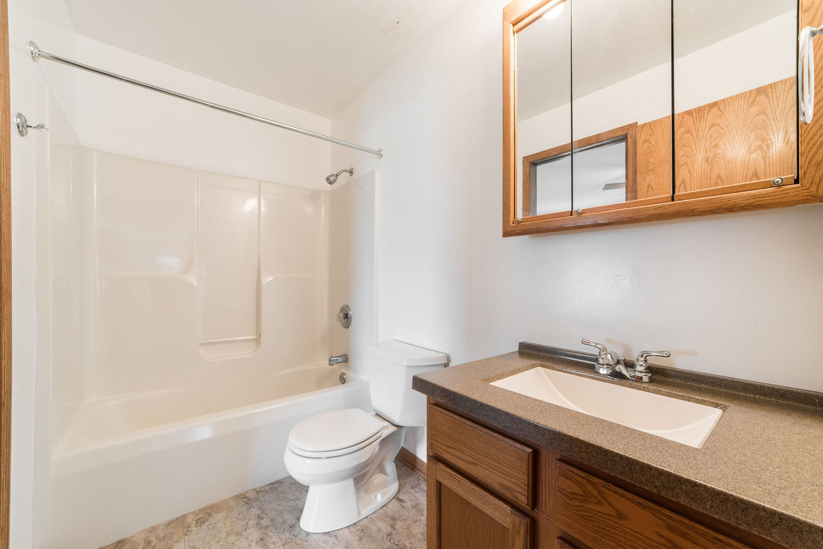 434 South Peace Road, Unit 434 Sycamore, IL 60178 - Photo 15 of 22 a bathroom with a sink a toilet and a bathtub