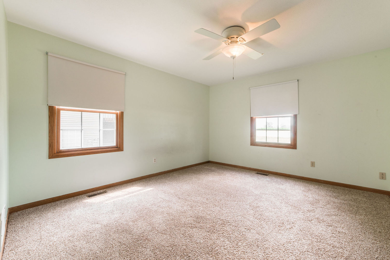 434 South Peace Road, Unit 434 Sycamore, IL 60178 - Photo 17 of 22 an empty room with windows and fan
