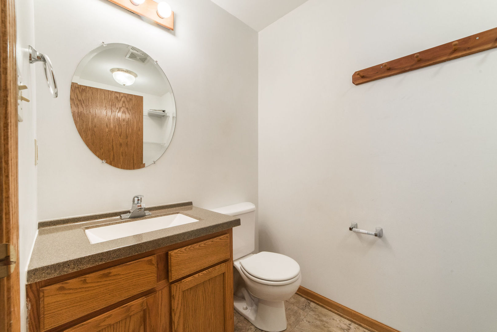 434 South Peace Road, Unit 434 Sycamore, IL 60178 - Photo 18 of 22 a bathroom with a toilet sink and mirror