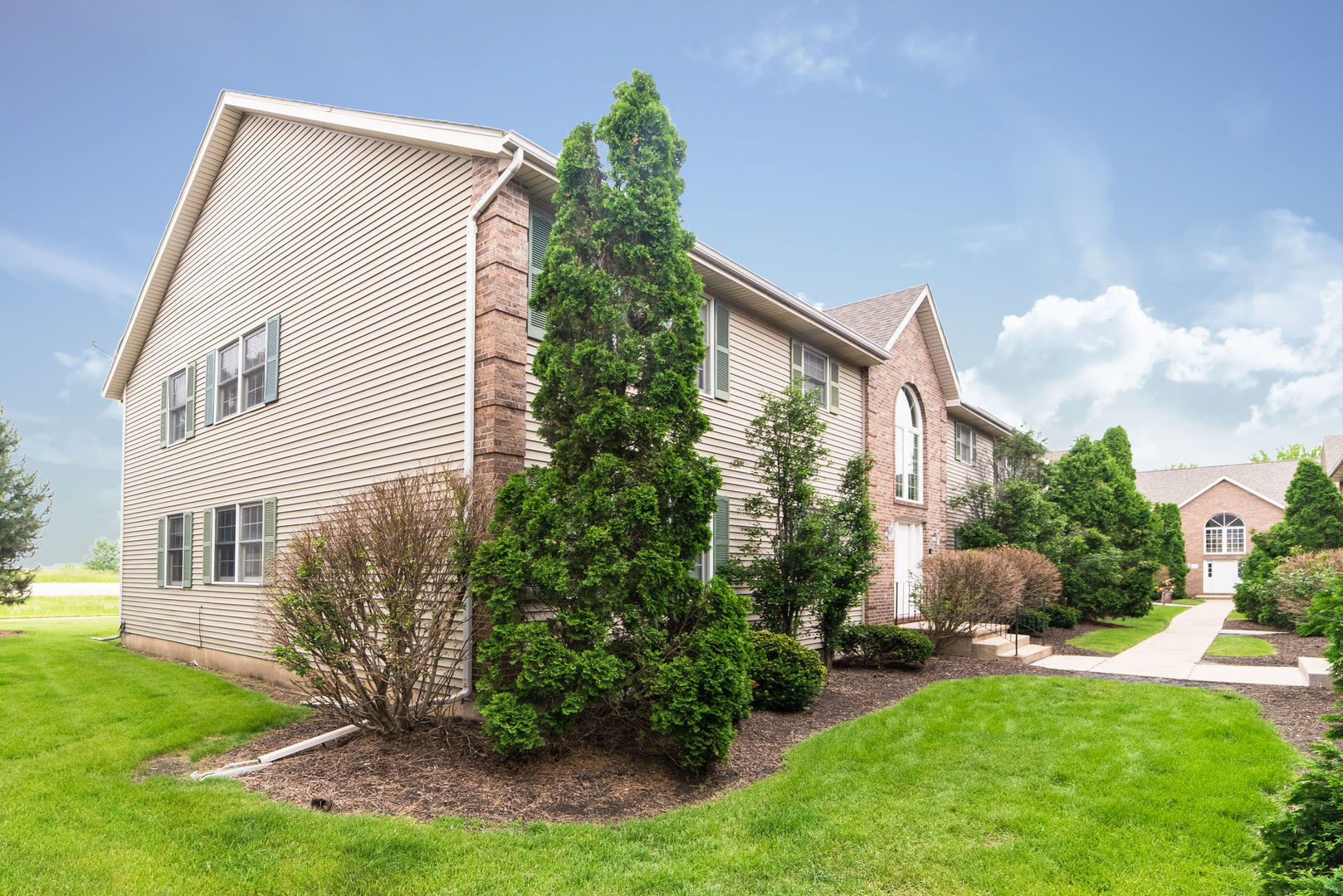 434 South Peace Road, Unit 434 Sycamore, IL 60178 - Photo 2 of 22 a view of backyard with garden and plants