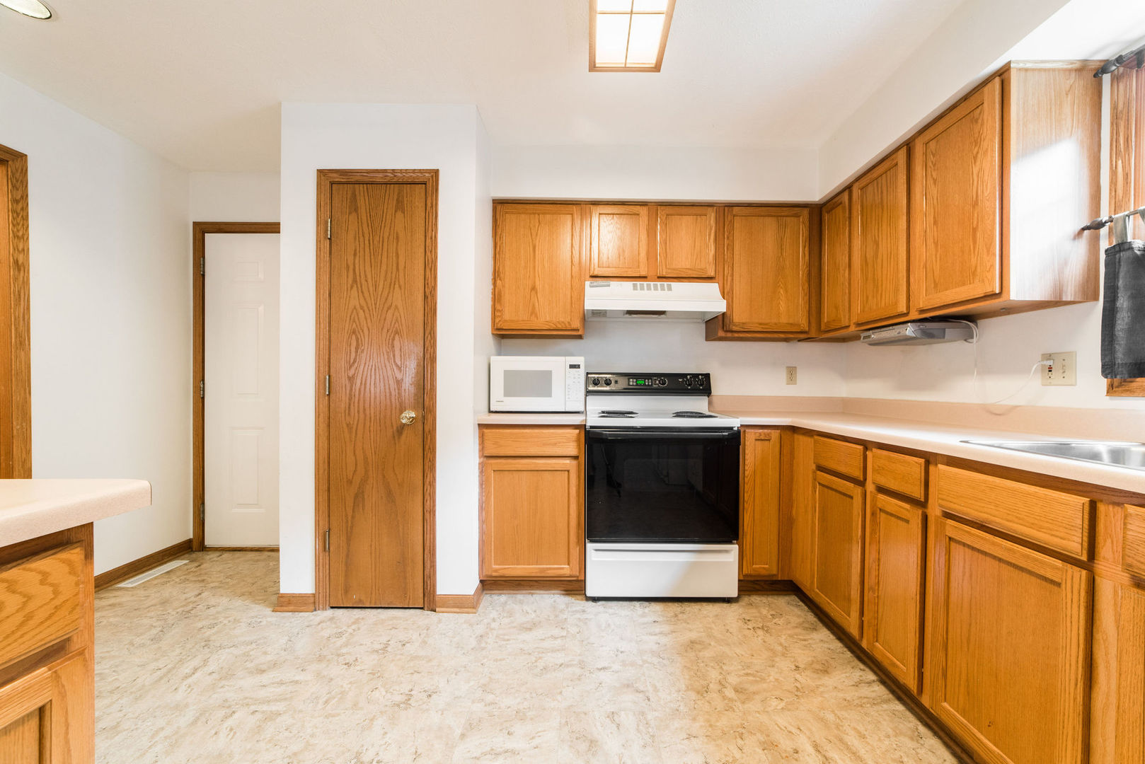 434 South Peace Road, Unit 434 Sycamore, IL 60178 - Photo 5 of 22 a kitchen with stainless steel appliances granite countertop a stove a sink and a refrigerator