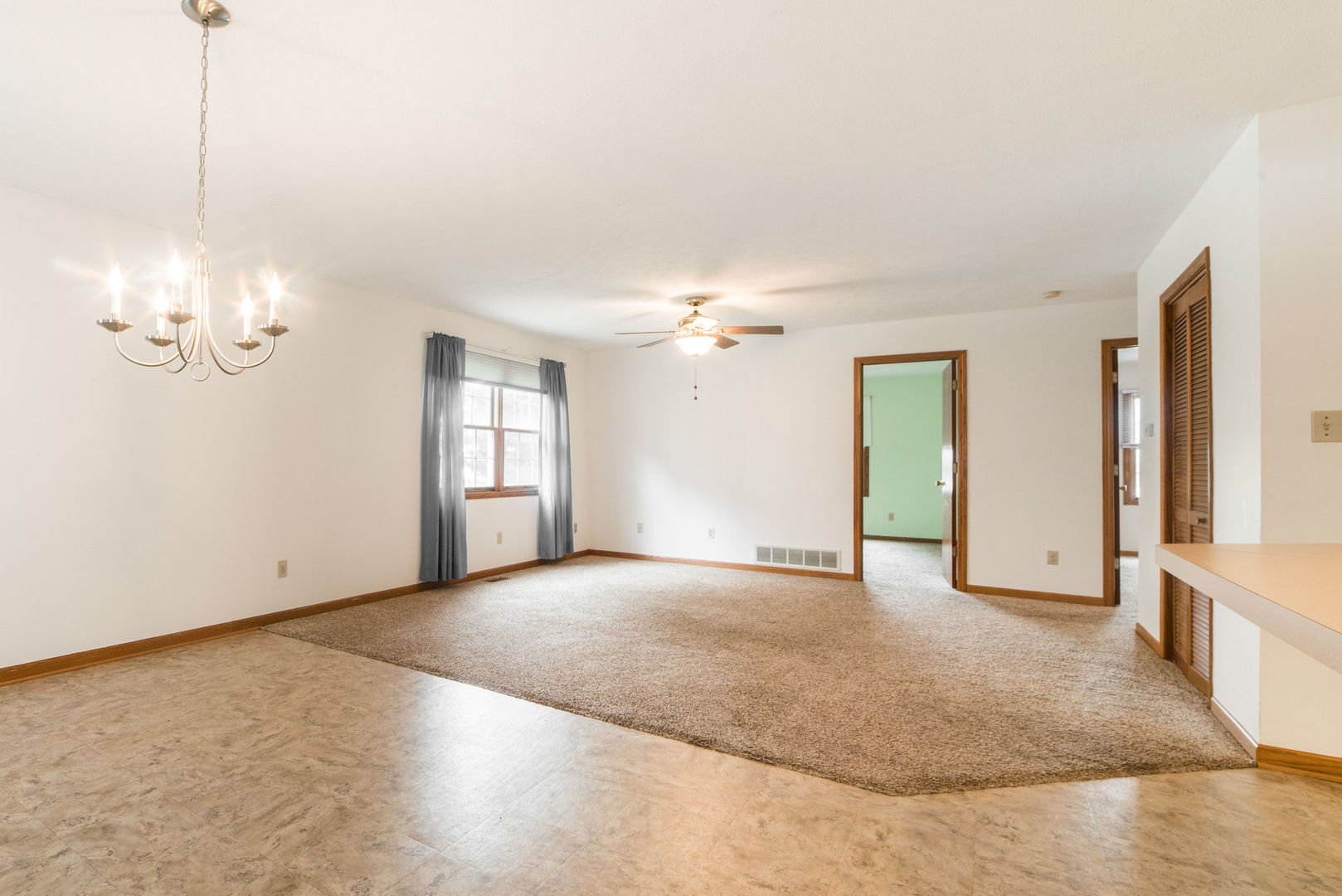 434 South Peace Road, Unit 434 Sycamore, IL 60178 - Photo 9 of 22 a view of an empty room with window and wooden floor