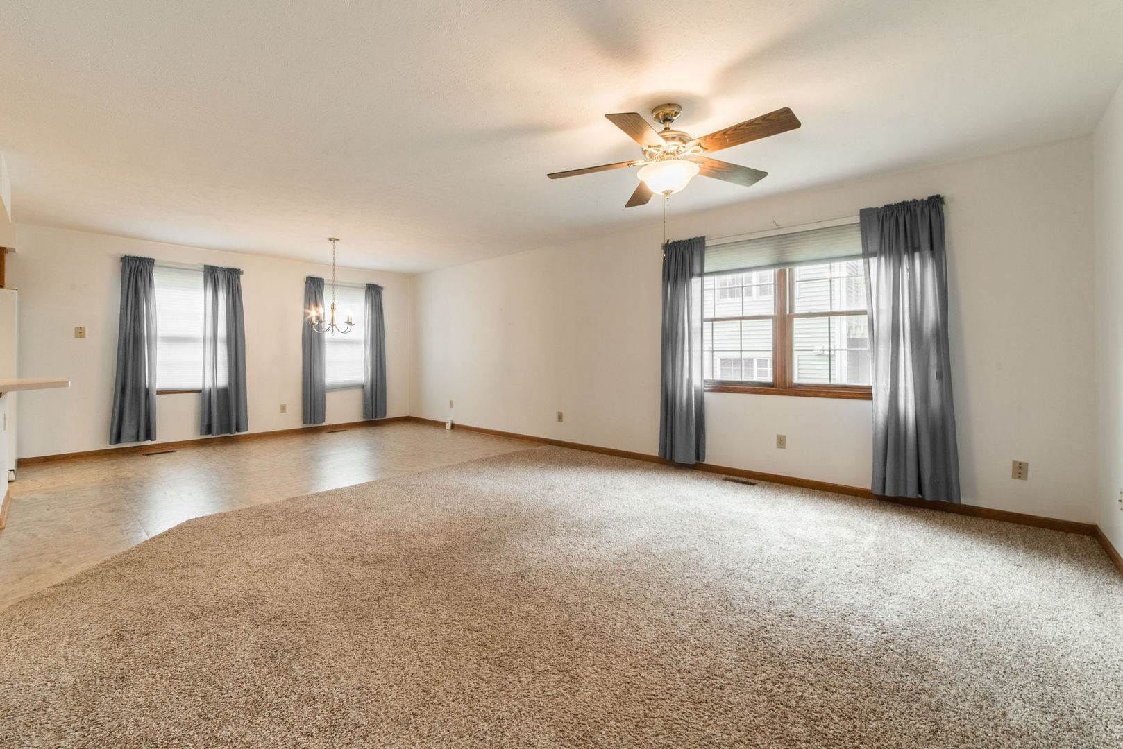434 South Peace Road, Unit 434 Sycamore, IL 60178 - Photo 10 of 22 a view of a livingroom with a ceiling fan and window