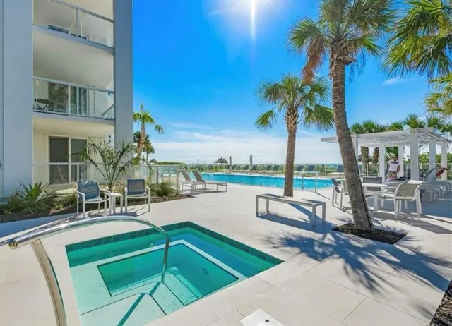 a view of a swimming pool with a patio
