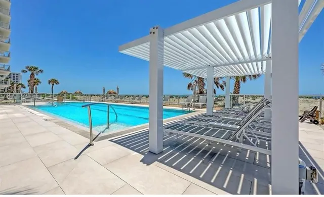 a view of a backyard with sitting area