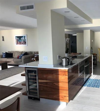 a kitchen with a stove and a refrigerator