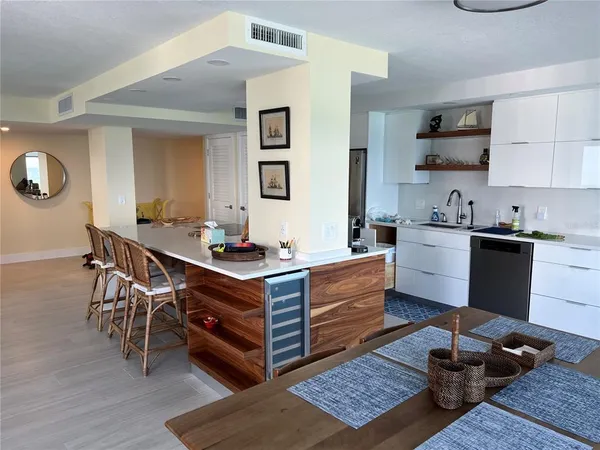 a room with furniture a rug and a window