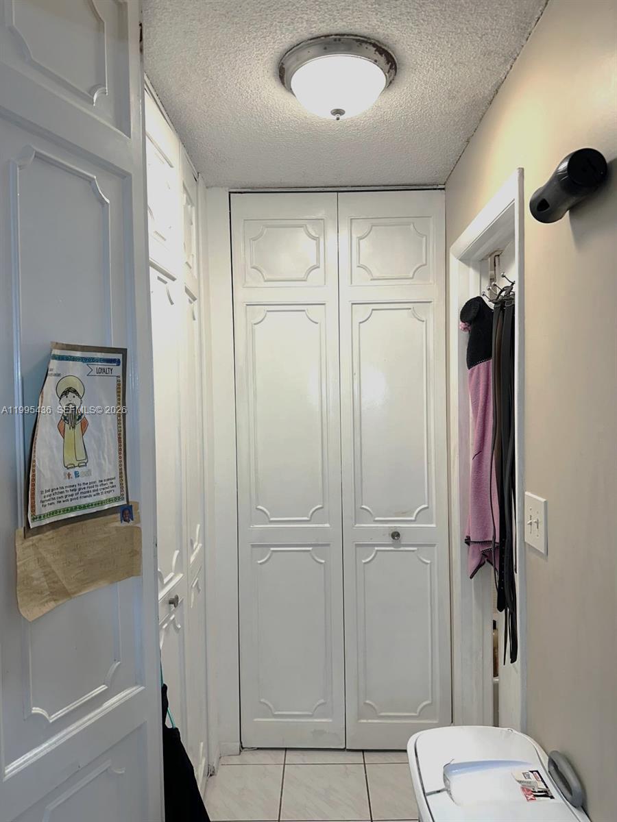 3720 Inverrary Drive, Unit 1J Lauderhill, FL 33319 - Photo 20 of 24 a bathroom with a shower and a toilet