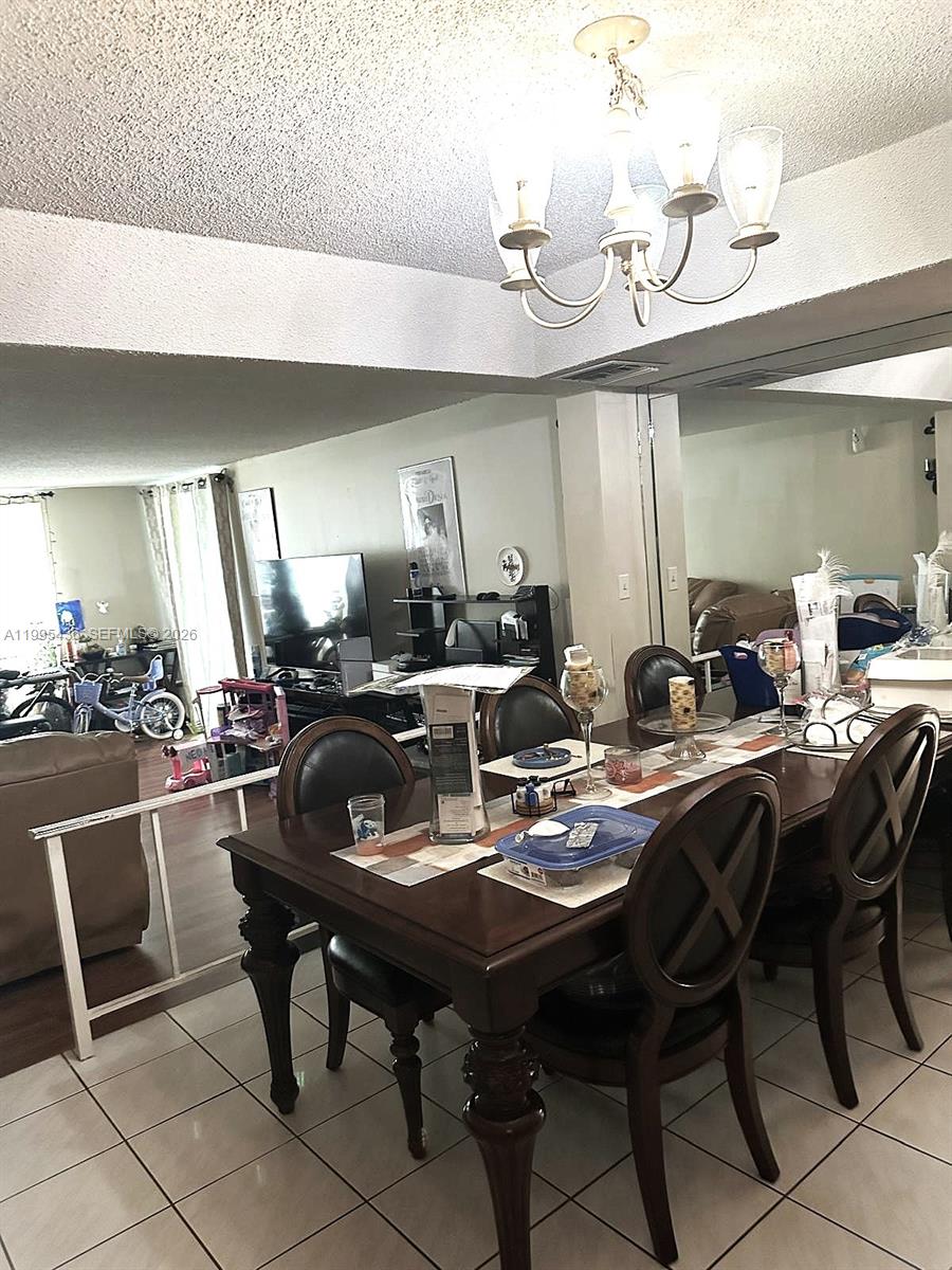 3720 Inverrary Drive, Unit 1J Lauderhill, FL 33319 - Photo 22 of 24 a view of a dining room and kitchen