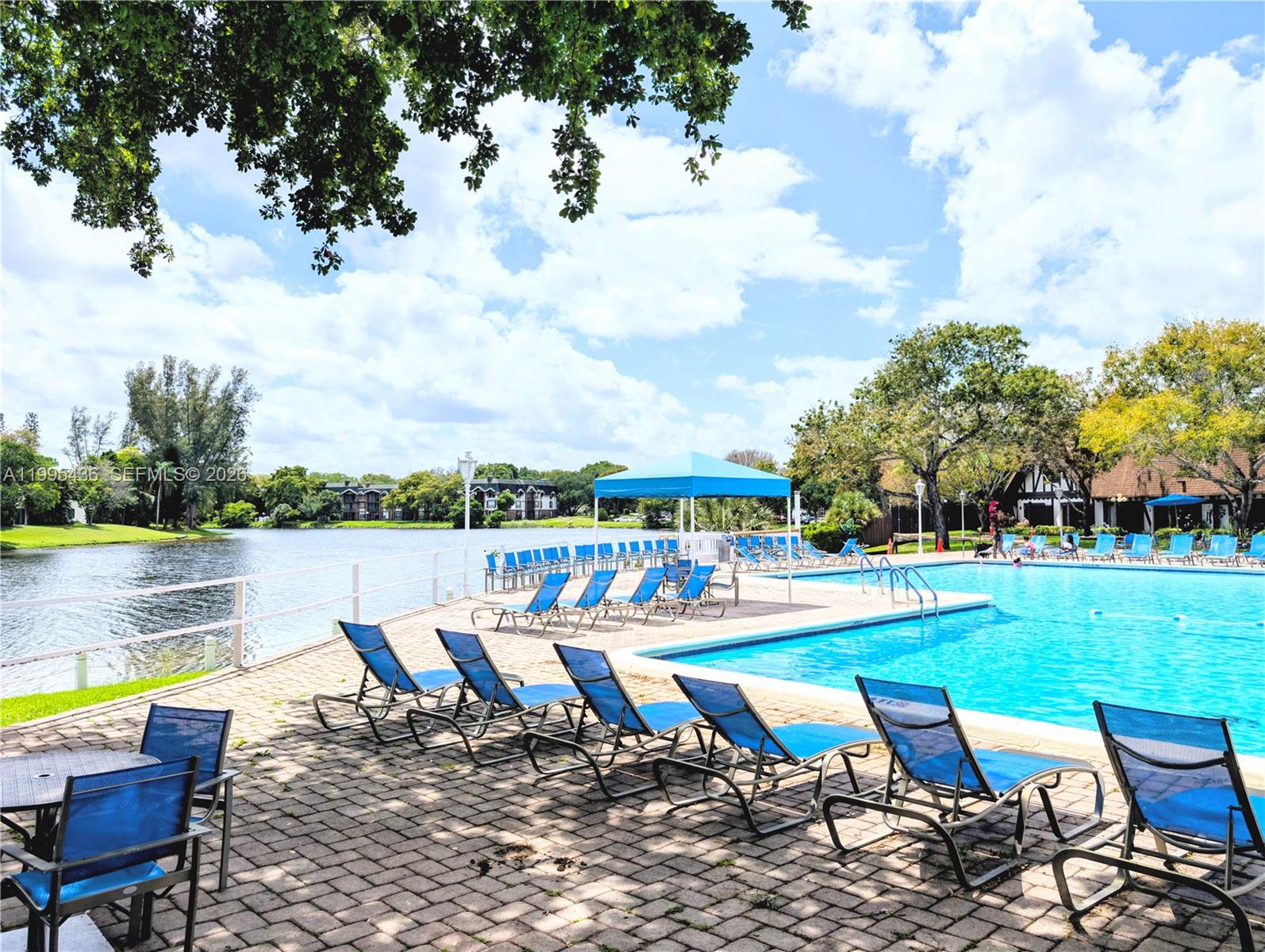 3720 Inverrary Drive, Unit 1J Lauderhill, FL 33319 - Photo 23 of 24 an outdoor space with furniture and garden
