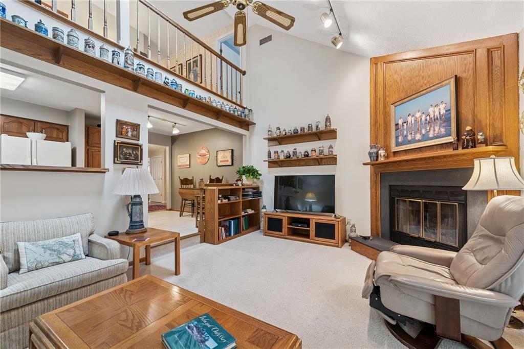 601 Timber Lane Sewickley, PA 15143 - Photo 14 of 45 a living room with furniture a flat screen tv and a fireplace