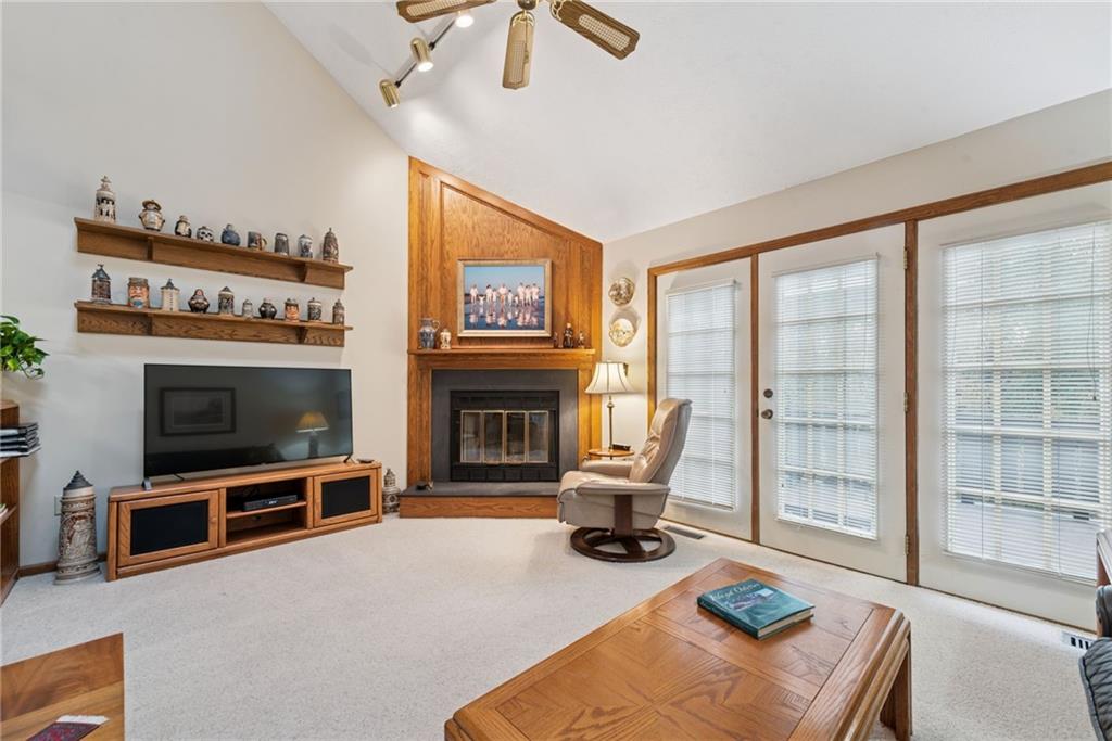 601 Timber Lane Sewickley, PA 15143 - Photo 16 of 45 a living room with furniture a flat screen tv and a fireplace