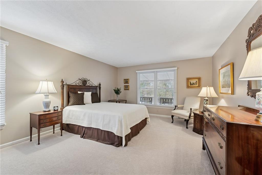 601 Timber Lane Sewickley, PA 15143 - Photo 17 of 45 a spacious bedroom with a bed and a window