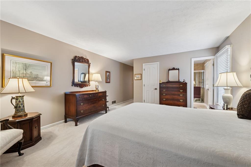 601 Timber Lane Sewickley, PA 15143 - Photo 18 of 45 a bedroom with a bed and wooden floor