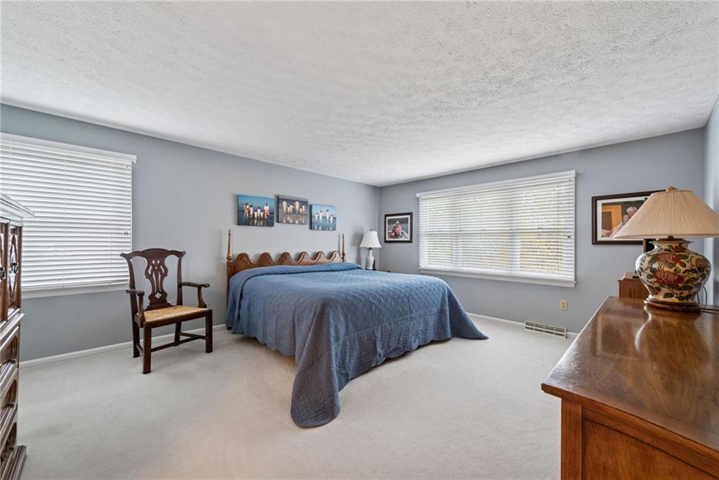 601 Timber Lane Sewickley, PA 15143 - Photo 21 of 45 a bedroom with a bed and a large window