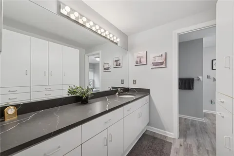 a bathroom with a sink and a mirror