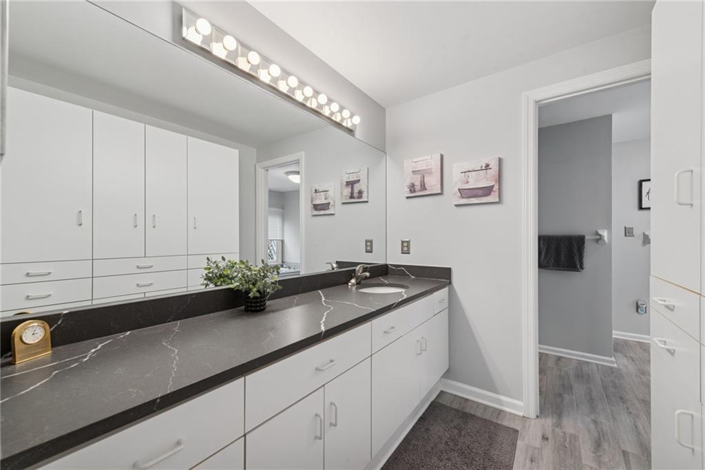 601 Timber Lane Sewickley, PA 15143 - Photo 23 of 45 a bathroom with a sink and a mirror