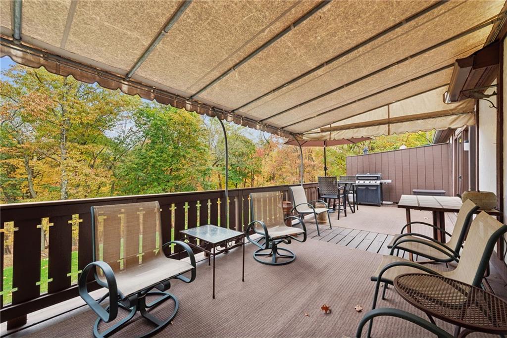 601 Timber Lane Sewickley, PA 15143 - Photo 33 of 45 a view of a patio with a table and chairs