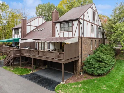 a backyard of a house with a garden and deck