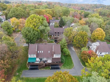 an aerial view of a house with a garden