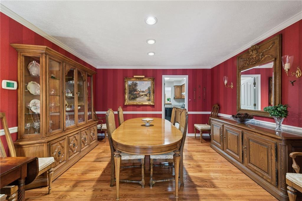 601 Timber Lane Sewickley, PA 15143 - Photo 9 of 45 a living room with furniture a rug and a chandelier