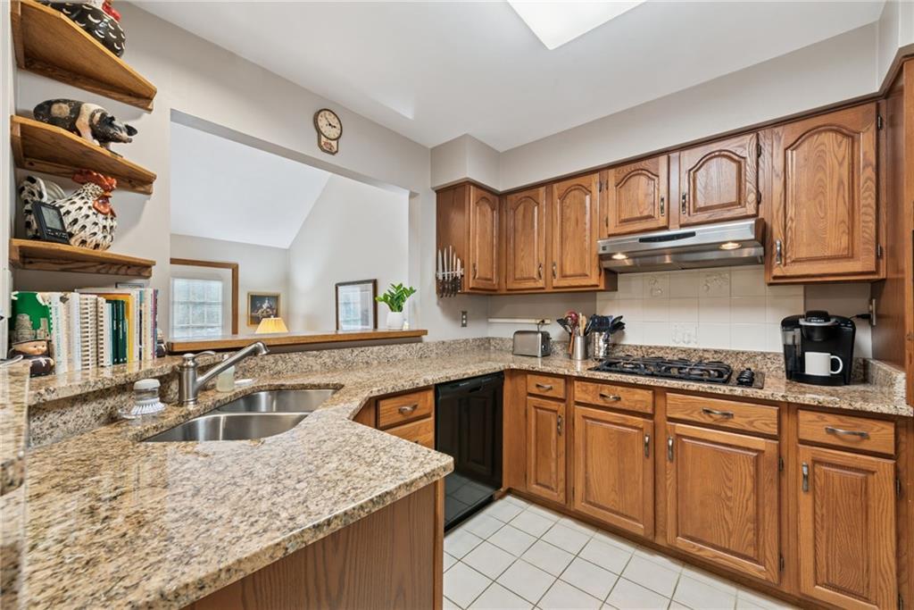 601 Timber Lane Sewickley, PA 15143 - Photo 10 of 45 a kitchen with stainless steel appliances granite countertop a sink stove and cabinets