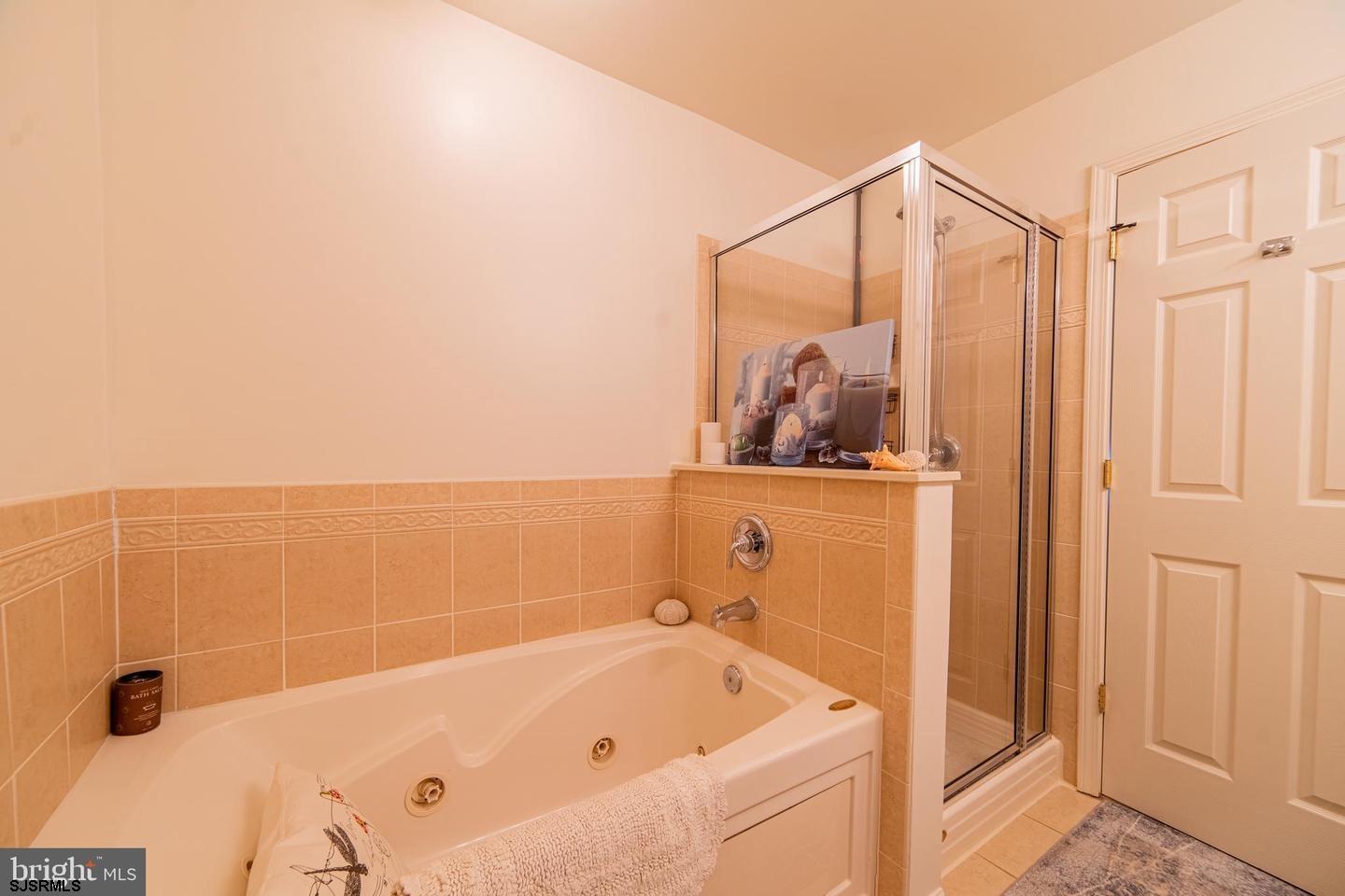 61 Dockside Drive, Unit 61 Somers Point, NJ 08244 - Photo 16 of 20 a bathroom with a bathtub and shower
