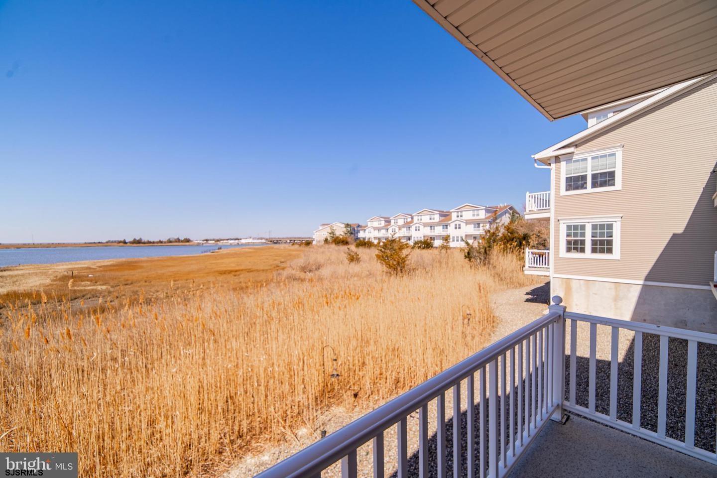 61 Dockside Drive, Unit 61 Somers Point, NJ 08244 - Photo 19 of 20 a view of a ocean from a balcony