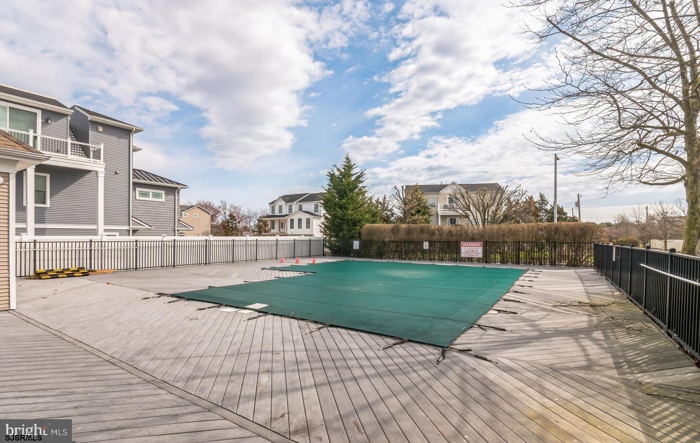 61 Dockside Drive, Unit 61 Somers Point, NJ 08244 - Photo 4 of 20 a view of a backyard with a garden