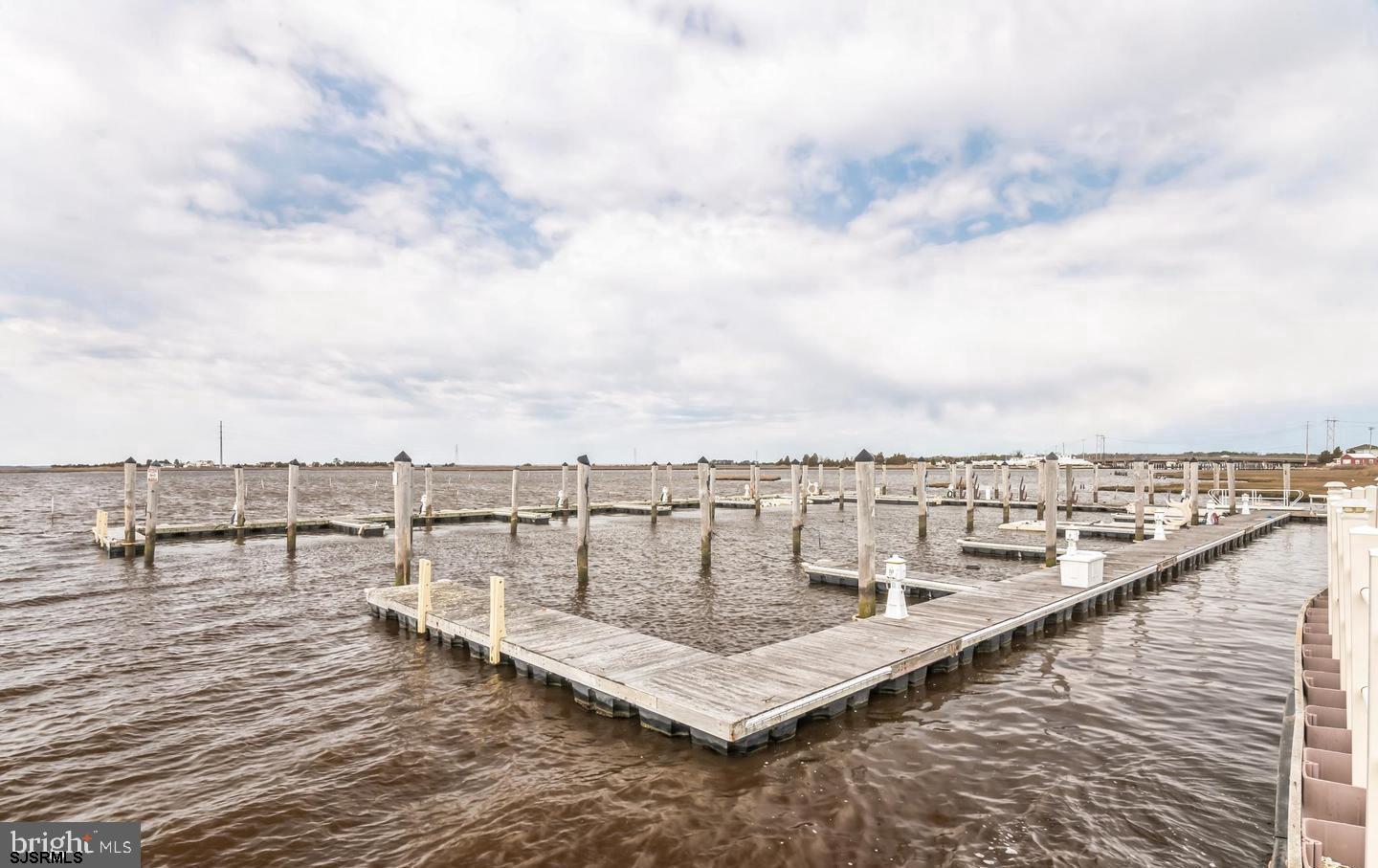 61 Dockside Drive, Unit 61 Somers Point, NJ 08244 - Photo 6 of 20 a view of a terrace with lawn chairs