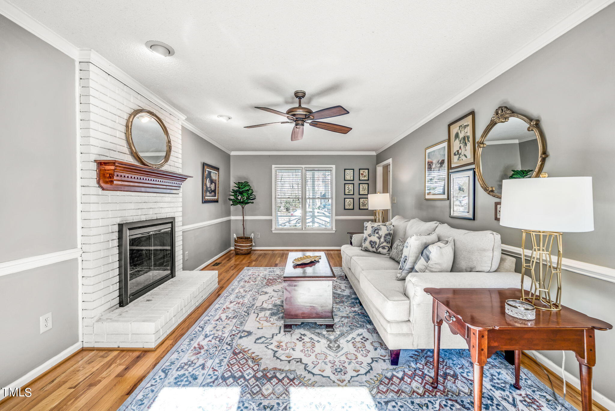 4117 Cary Oaks Drive Apex, NC 27539 - Photo 11 of 38 a living room with furniture a fireplace and a table
