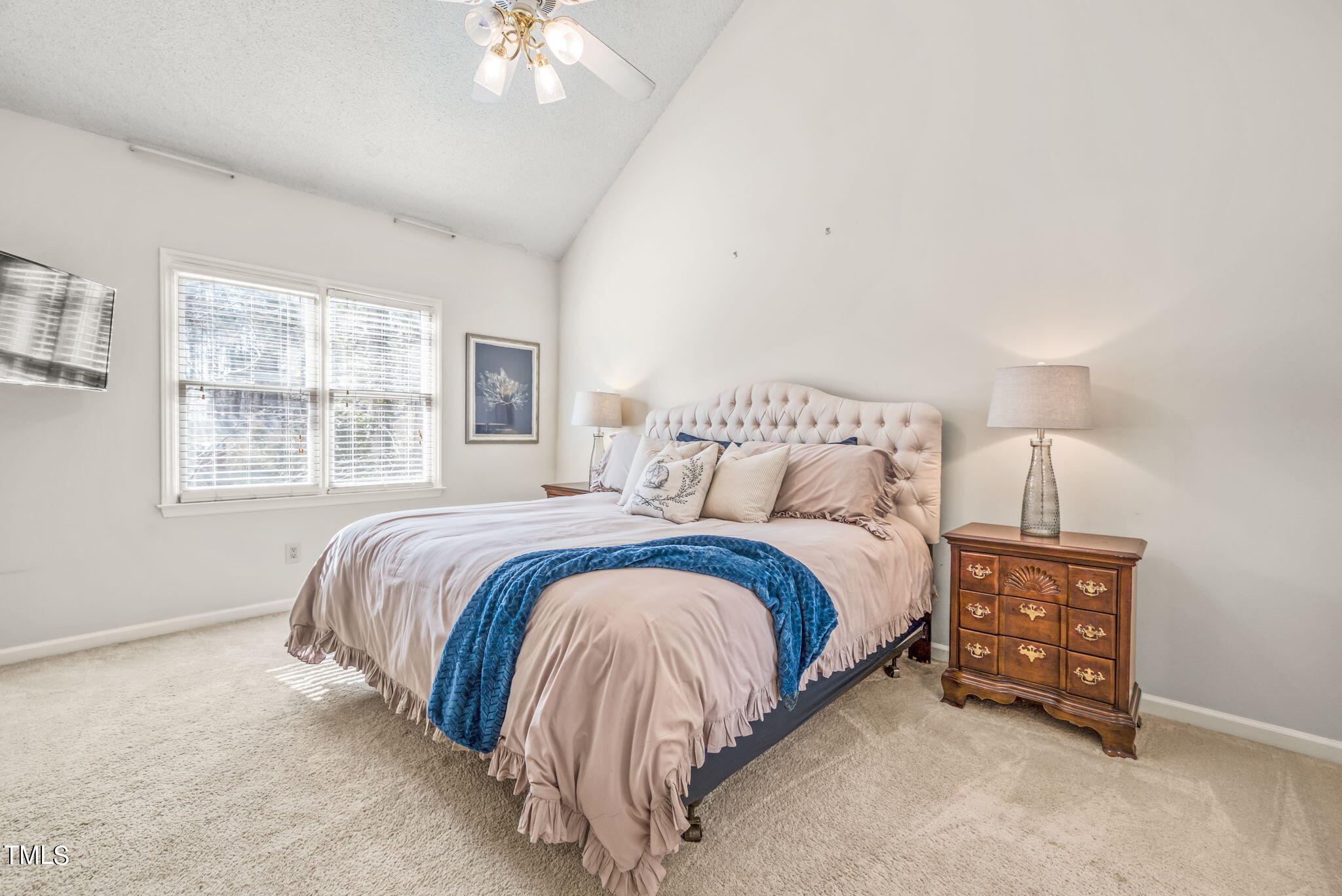 4117 Cary Oaks Drive Apex, NC 27539 - Photo 23 of 38 a spacious bedroom with a bed and a window