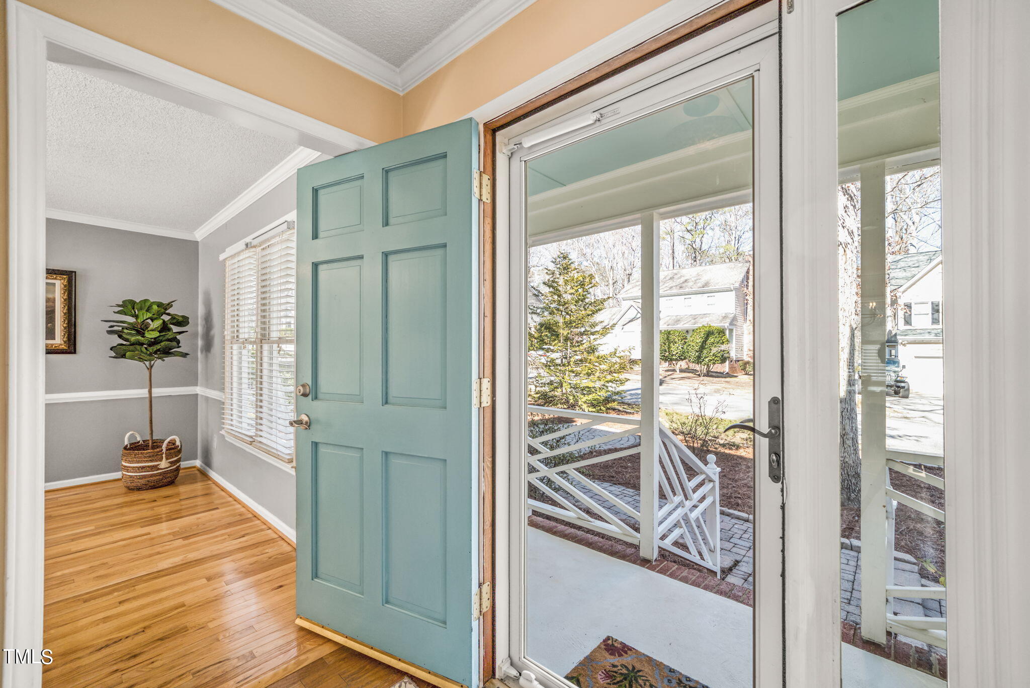 4117 Cary Oaks Drive Apex, NC 27539 - Photo 3 of 38 a very nice looking room with a large window and wooden floor