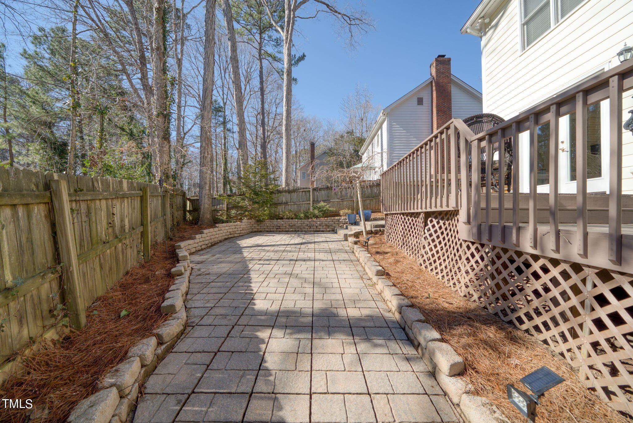 4117 Cary Oaks Drive Apex, NC 27539 - Photo 37 of 38 a view of a pathway with a wrought fence