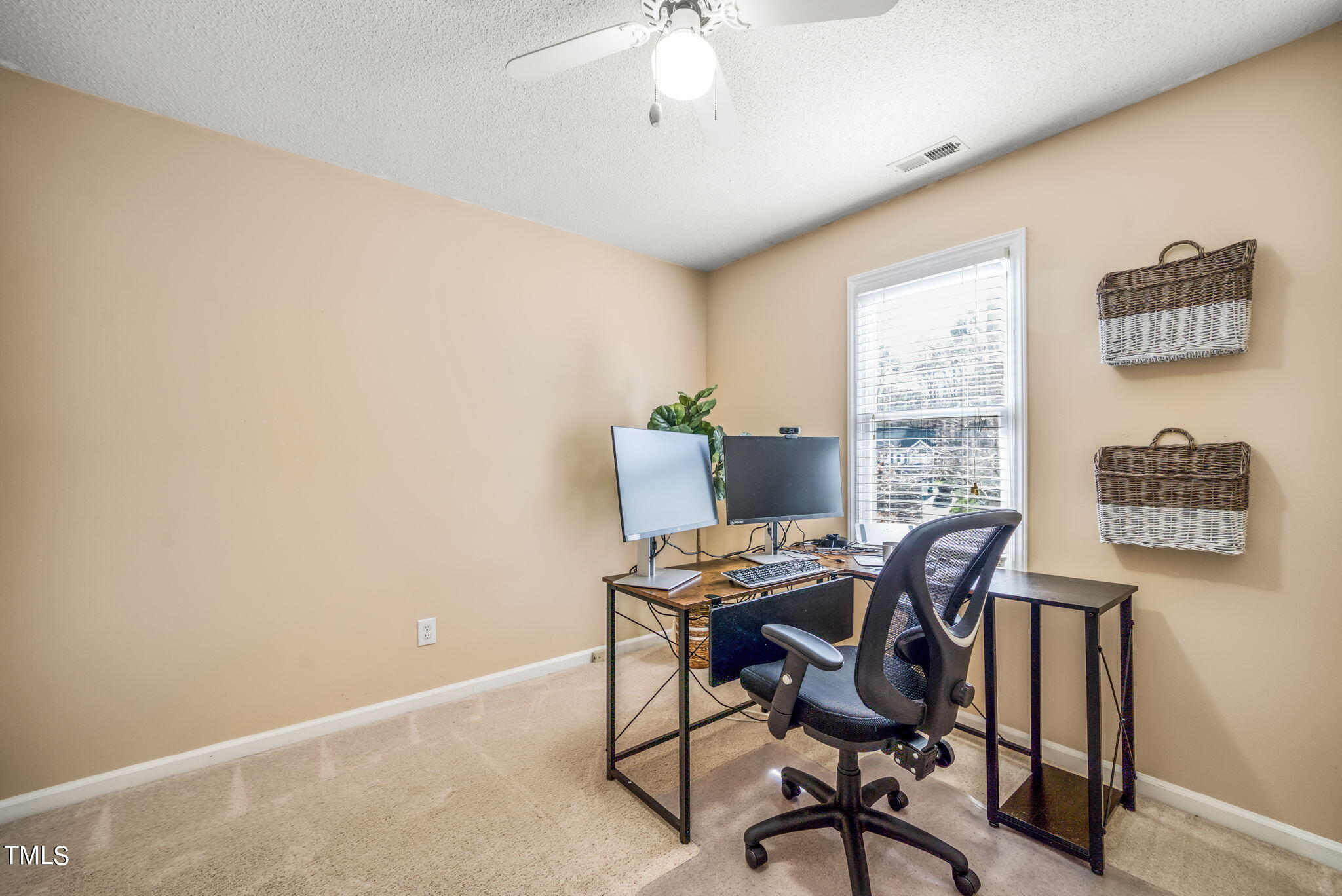 4117 Cary Oaks Drive Apex, NC 27539 - Photo 4 of 38 a workspace with furniture and a window