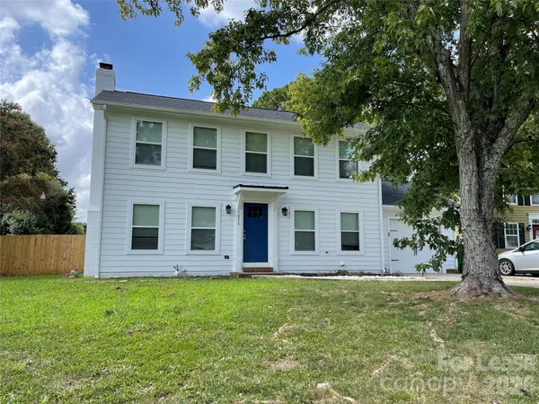a view of a house with a garden