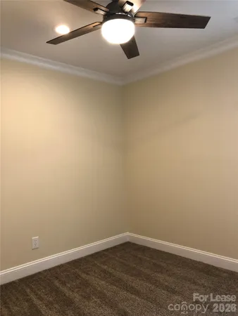 en empty room with wooden floor