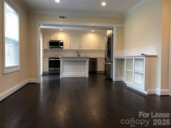 a view of a kitchen with a sink and a stove