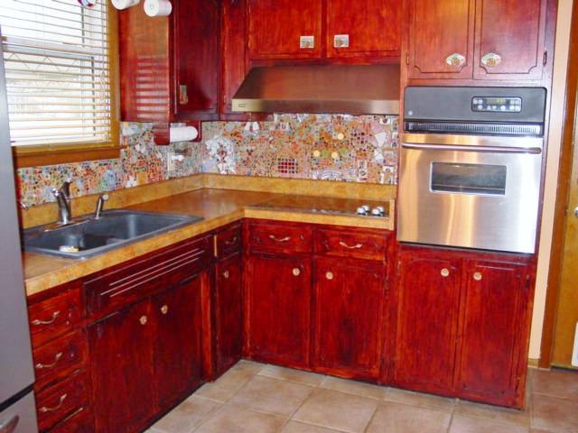 555 Rural Hill Road Nashville, TN 37217 - Photo 8 of 20 CLOSER VIEW OF THE KITCHEN... MORE CABINETRY TO THE RIGHT (NOT SEEN FROM THIS VIEW). SPECIAL BACK SPLASH MADE OF "HAND SET" STONES, MARBLES, TILE PIECES.... AWESOME TOUCH!