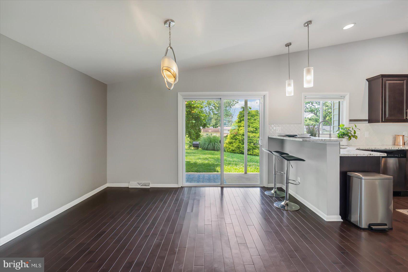 5818 Stuart Avenue Baltimore, MD 21215 - Photo 14 of 64 Dining room leads to covered rear porch.